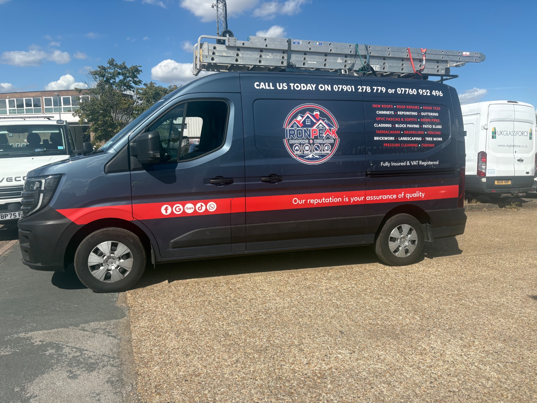 Iron Peak Roofing & Building branded van listing roofing and building services