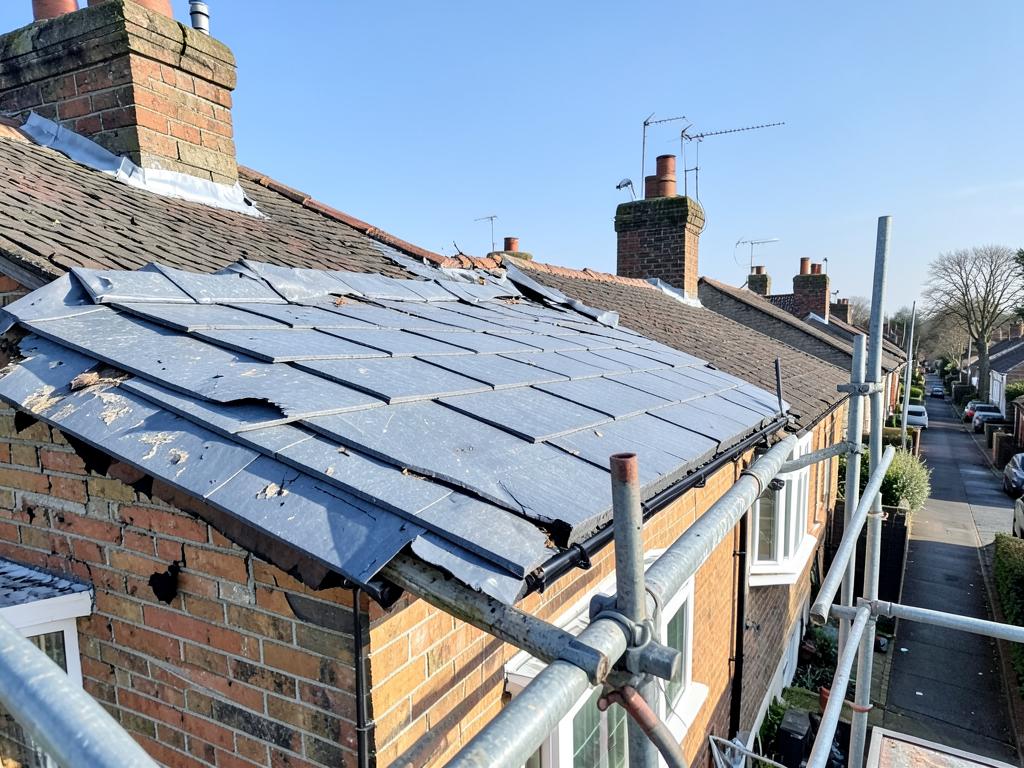 Repaired roof ridge with new bedded ridge tiles after storm damage on a house in Braintree, Essex